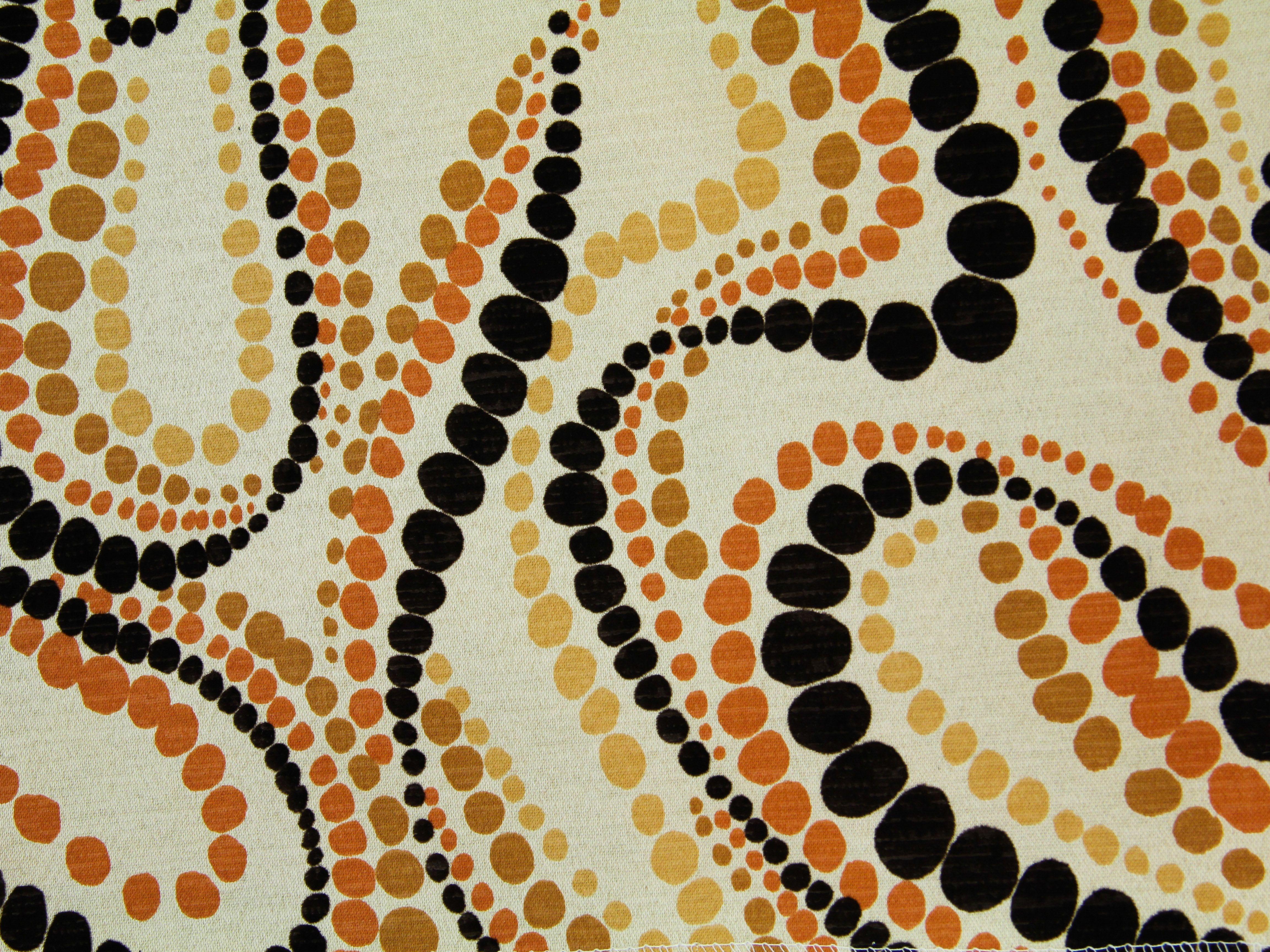 Swirling Orange Dots Logo - polka dot texture fabric 70s orange swirl cloth pattern stock photo ...