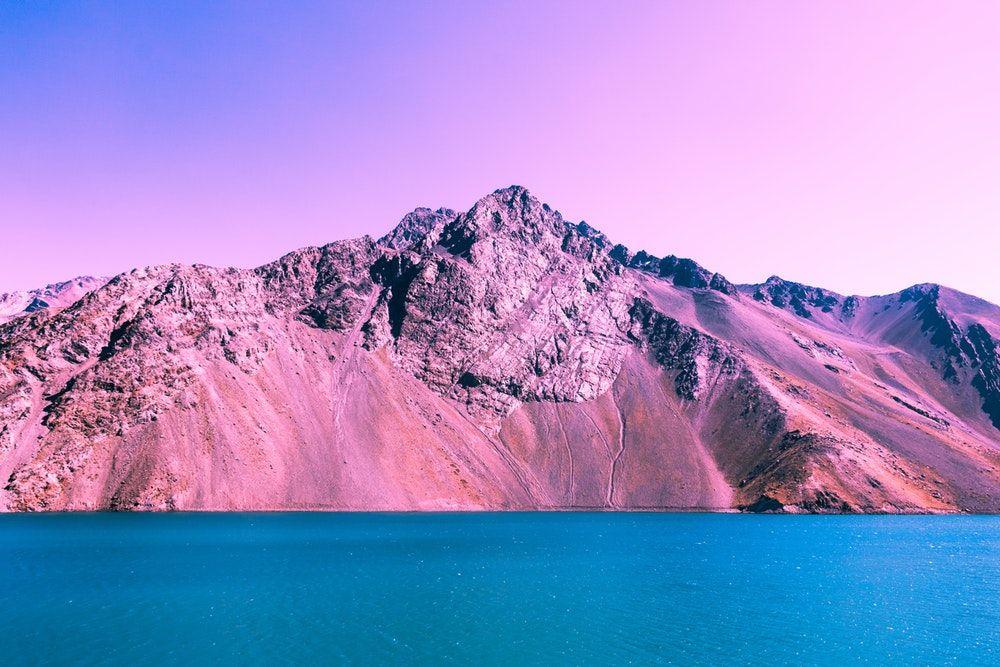 Pink and Blue Mountain Water Logo - Embalse el Yeso photo by Rod Sot (@rodsot) on Unsplash