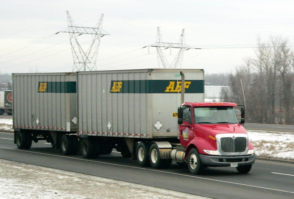 ABF Trucking Company Logo - A red ABF truck