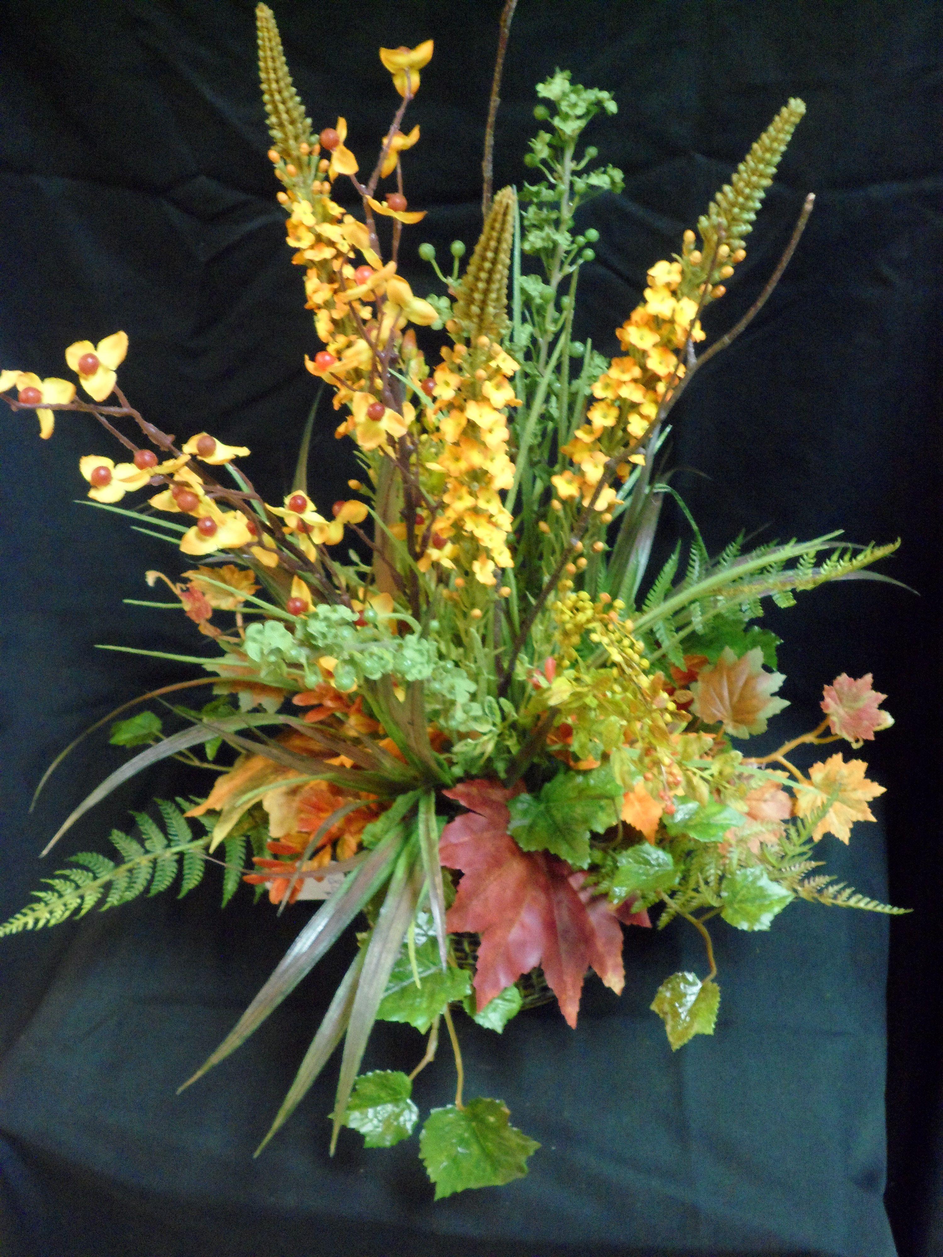 Tiny Orange Leaf Logo - A stunning fall arrangement with red and orange leaves at Little