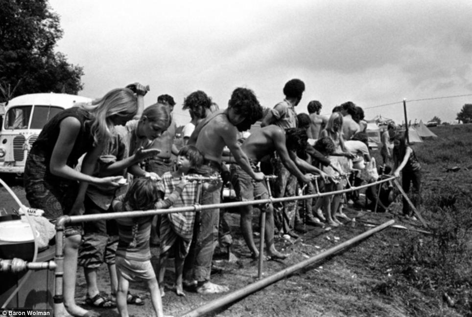 Black and White Woodstock Logo - Unseen Wood recall an era of peace, love and hippies