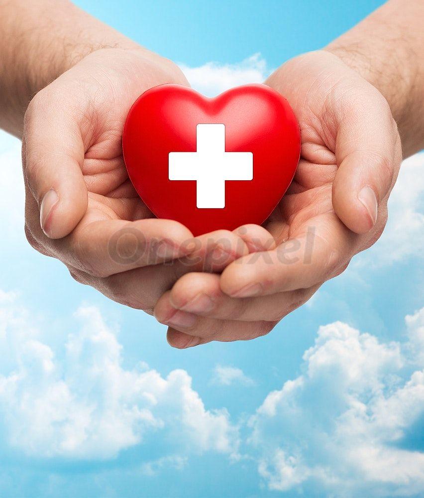 Red Heart with White Cross Logo - Male hands holding red heart with white cross