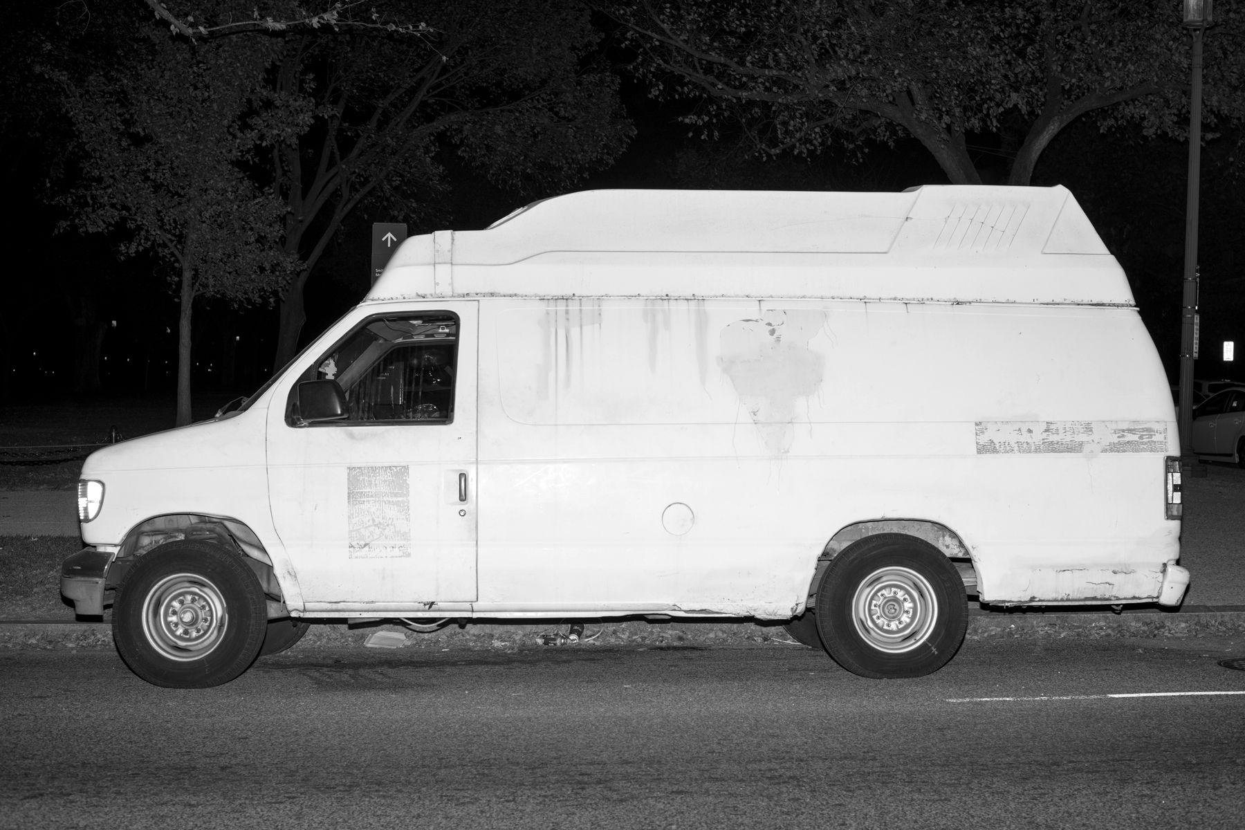 Black and White Vans Car Logo - White Vans & Black Suburbans. The New Republic