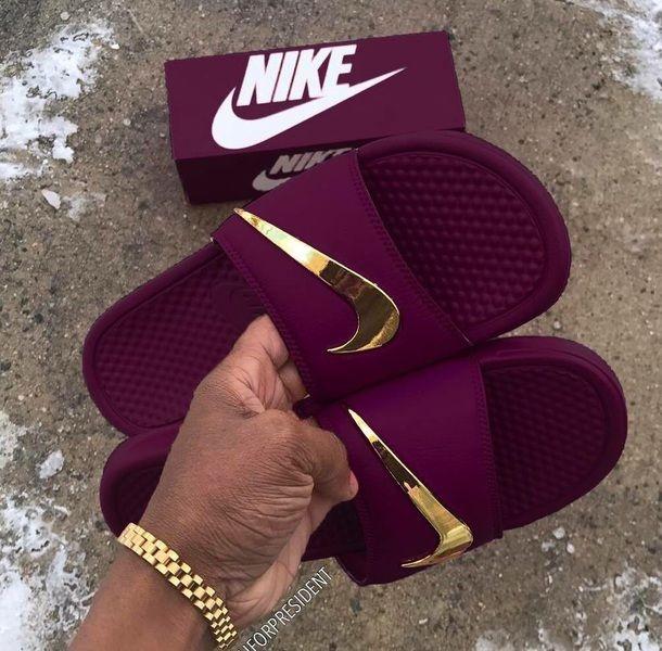 red and gold nike flip flops
