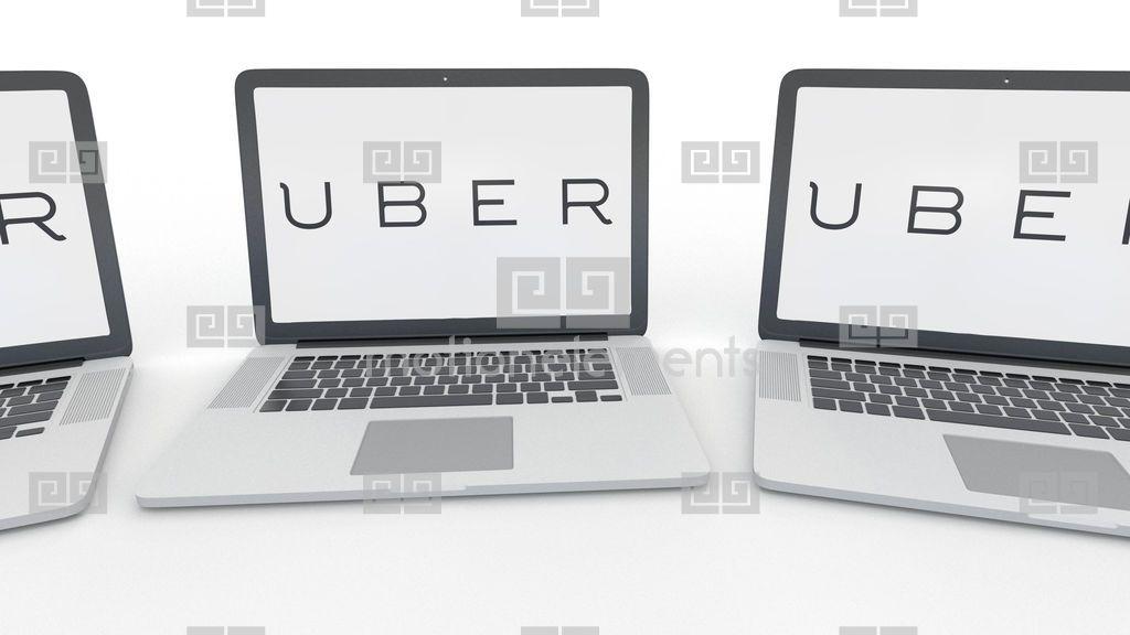 Uber Technologies Logo - Notebooks With Uber Technologies Inc. Logo On The Screen. Computer ...