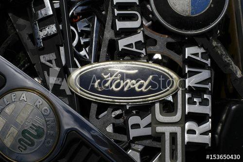 Old Ford Motor Company Logo - An old Ford emblem is displayed with other car companies logos at