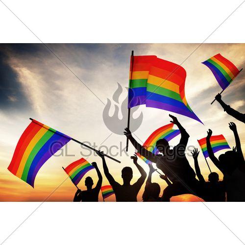 Person Holding Rainbow Logo - Group Of People Holding Rainbow Flags · GL Stock Images