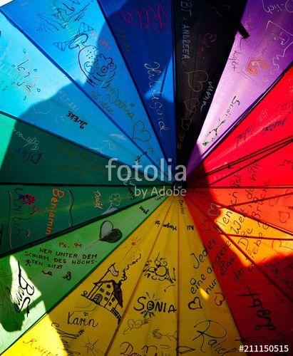 Person Holding Rainbow Logo - people holding giant rainbow flag at pride parade - LGBT symbol ...