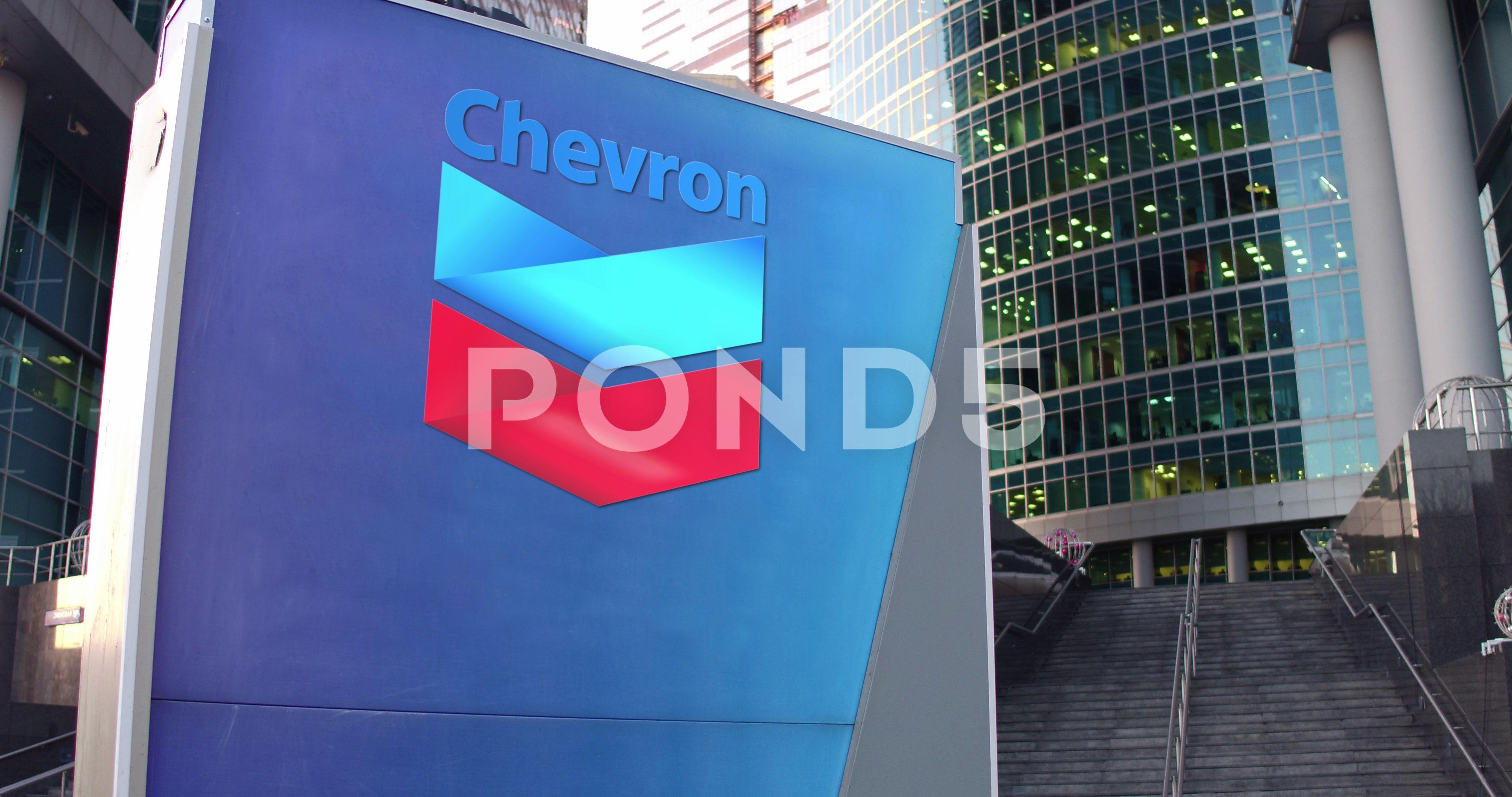 Chevron Corporation Logo - Video: Street signage board with Chevron Corporation logo. Modern