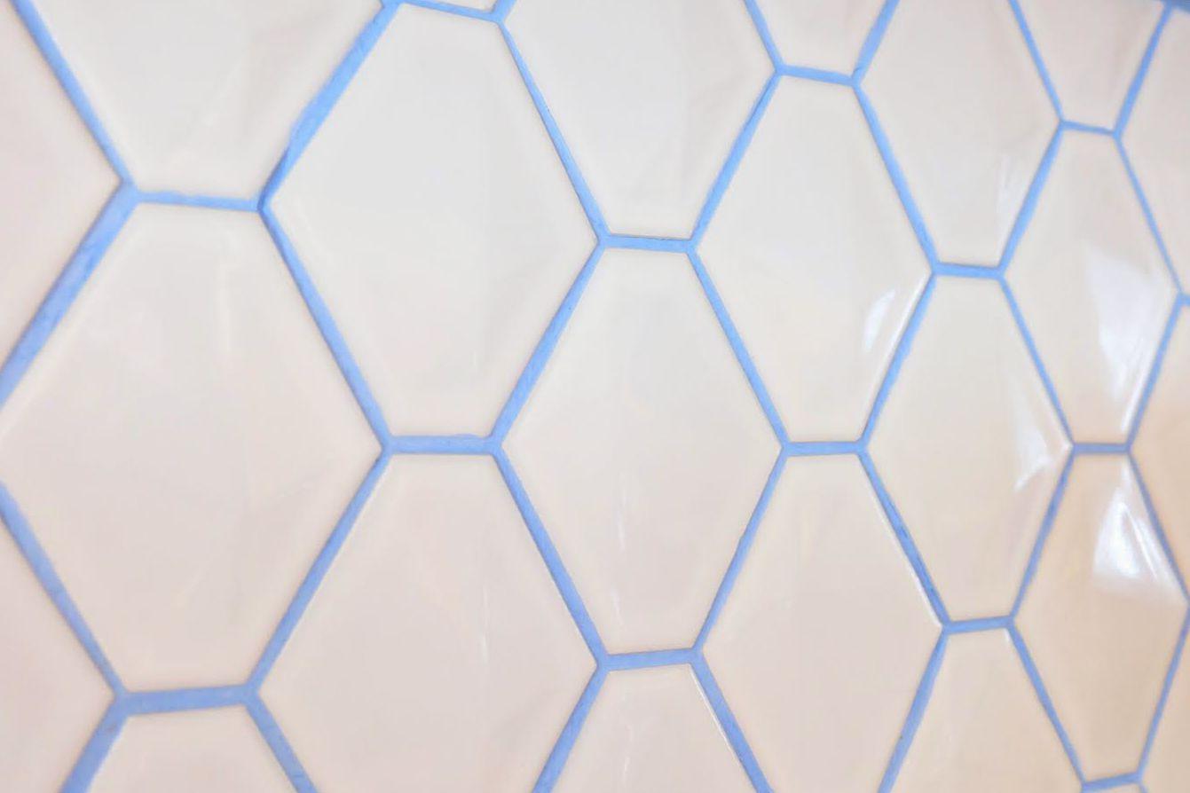 Hexagon White with Red Hourglass Logo - Ways Colorful Grout Spices Up Boring White Tile