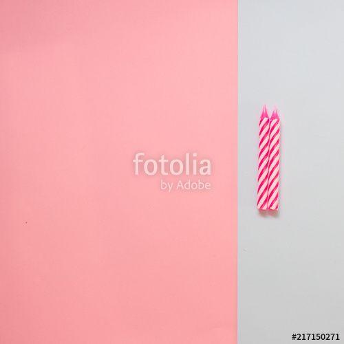 Colored Stripe Logo - Two pink striped candles for birthday on the pastel colored