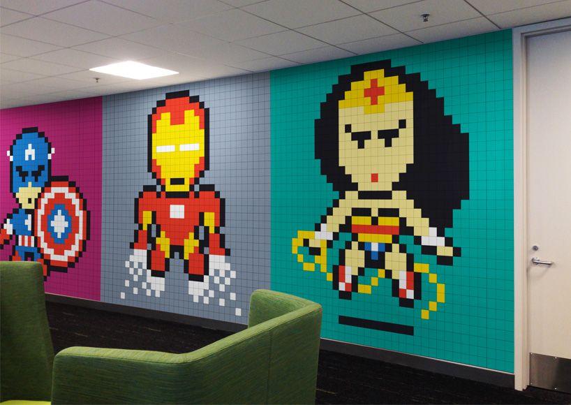 8-Bit Superhero Logo - office workers install 8-bit superhero mural using 8,024 sticky notes