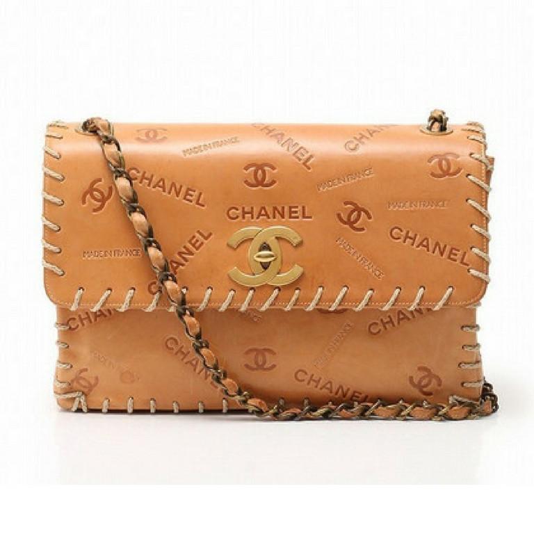 Brown Chanel Logo - Vintage CHANEL tan brown allover logo embossed leather jumbo, large