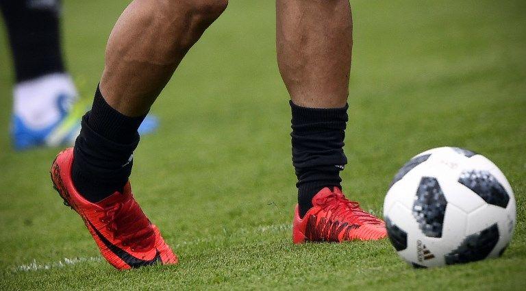 Shoe Kicking Soccer Ball Logo - US sanctions force Nike to drop Iran soccer shoe deal | The Times of ...