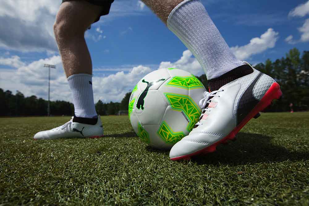 Shoe Kicking Soccer Ball Logo - Soccer Ball 101