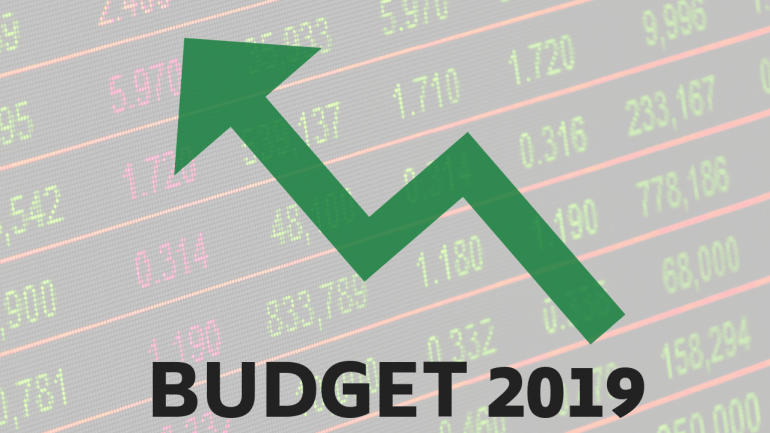 Sideways Green Triangle Logo - Interim Budget 2019: 20 stocks to buy that are likely to benefit the ...