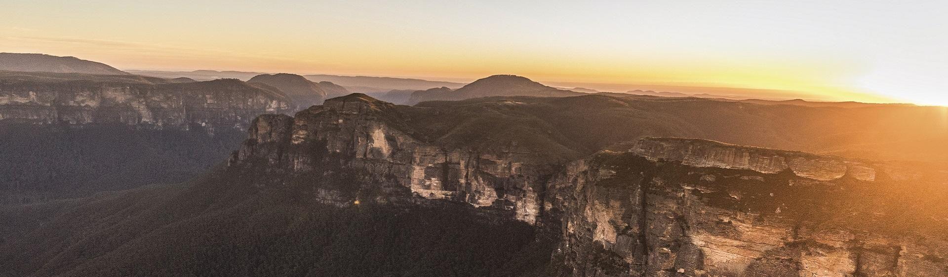 Pink White and Blue Mountains Logo - Blue Mountains Sydney - Find a Blue Mountains Tour, Spa & Retreat