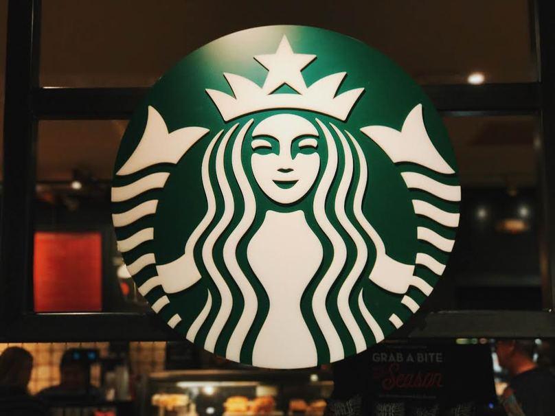 Large Starbucks Logo - The History Behind Starbucks' Mermaid Logo