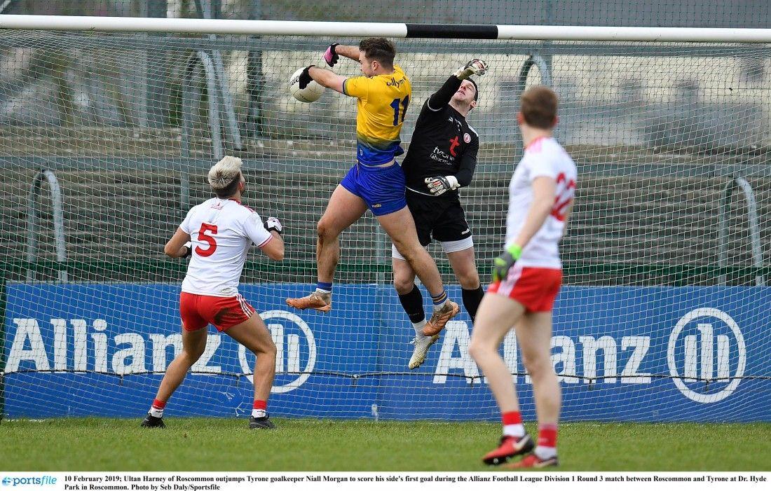 Red Hands On Ball Logo - Red Hands share the spoils with Rossies - Ulster Herald