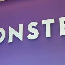 Purple Monster Logo - Monster's booth during the HR. Worldwide Office Photo