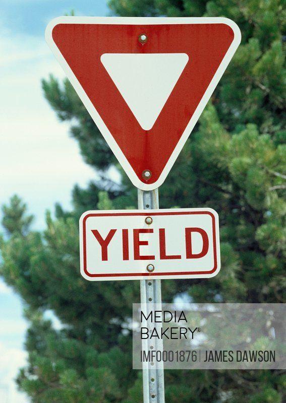 Green Tree with Red S Logo - Mediabakery - Photo by Image Farm - A red and white, triangular ...