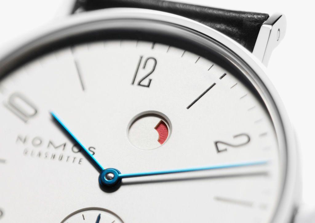 Nomos Logo - Tangente date power reserve