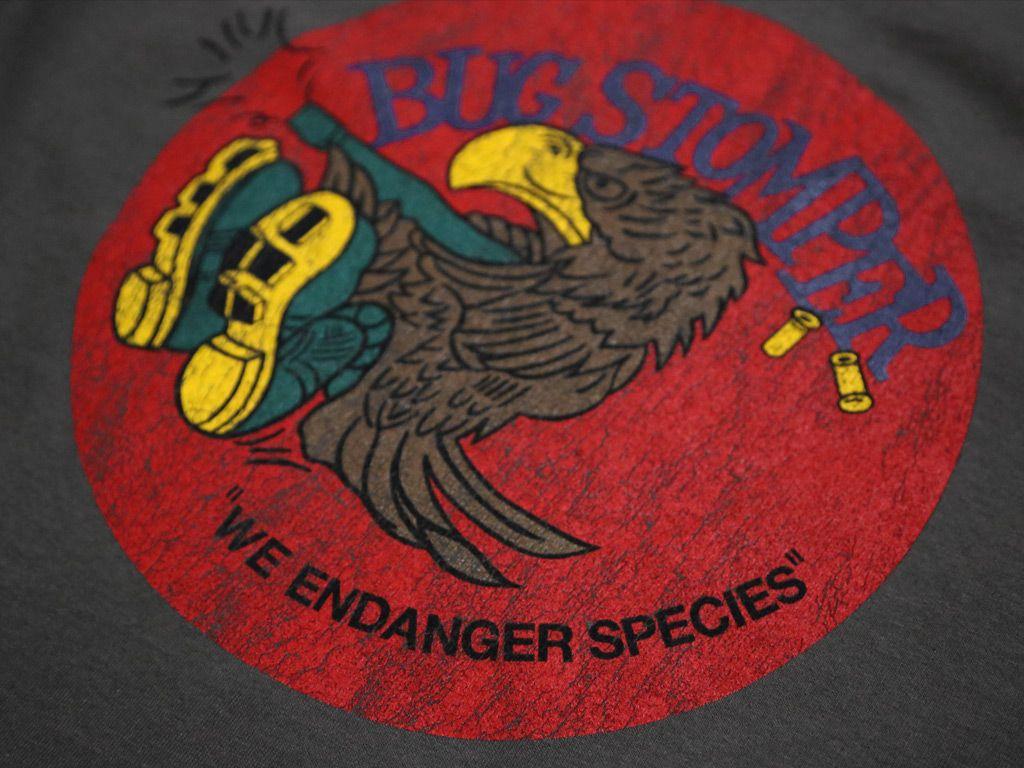 Stomper Logo - BUG STOMPER (CHARCOAL) T SHIRT. Last Exit To Nowhere