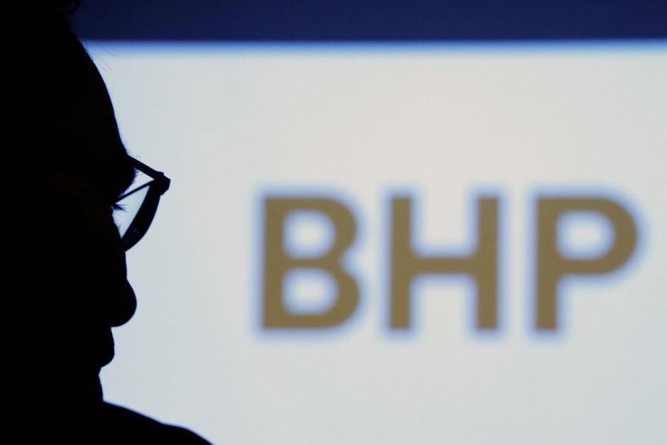 BHP Logo - BHP Billiton Chief Executive Andrew Mackenzie is silhouetted against ...