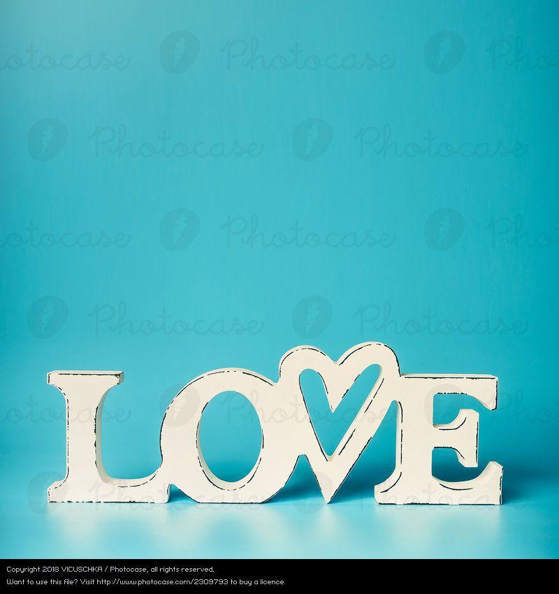 Blue and White Word Logo - Word Love on turquoise blue background Royalty Free