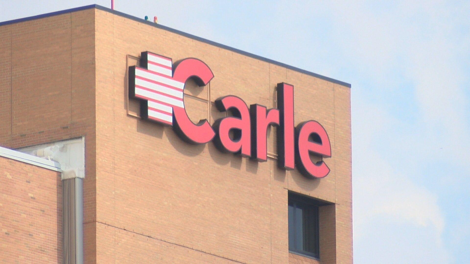 Carle Logo - Two leaders leaving Carle hospital