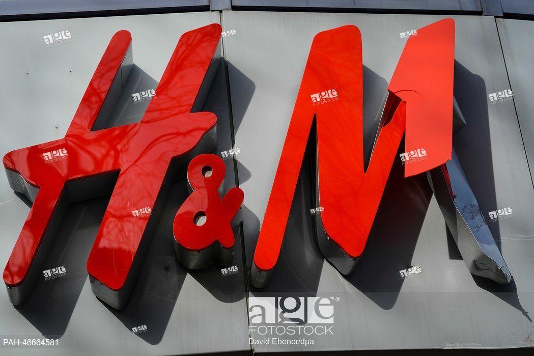 Hennes Logo - A broken logo of fashion chain Hennes and Mauritz (H&M) hangs above ...