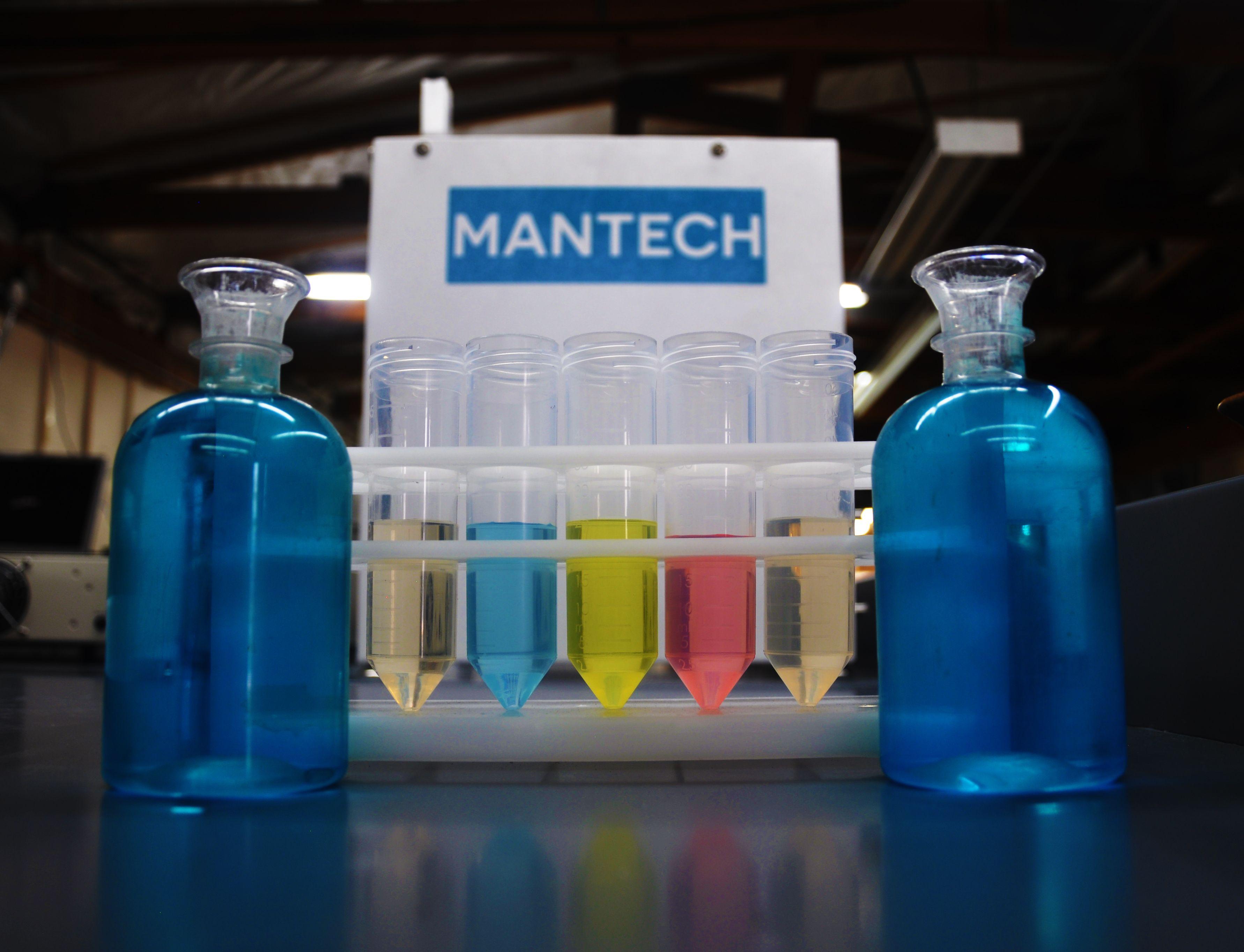 ManTech Logo - Mantech logo with test tubes - Mantech