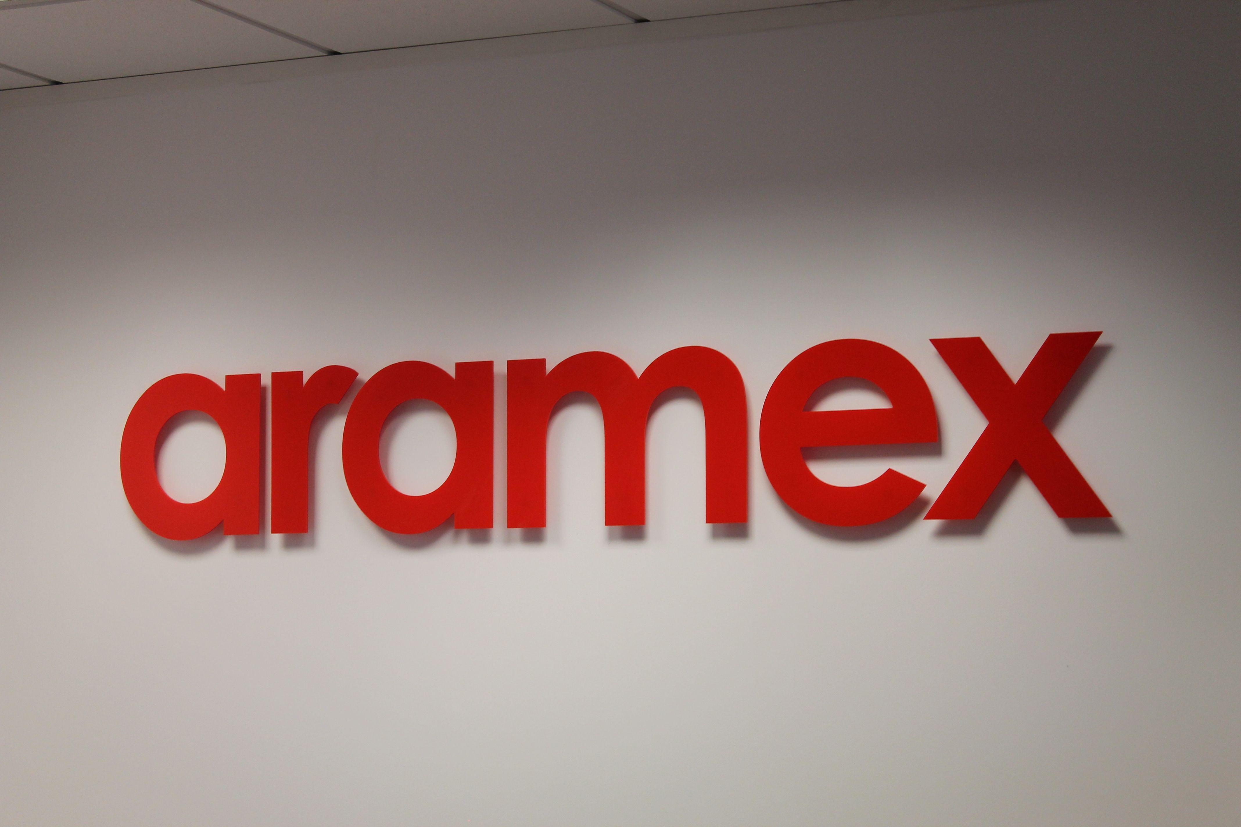 Aramex Logo - Brand signs hung in #reception area of #Aramex. Aramex (UK) Ltd