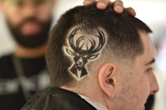 Shaved Logo - Bucks employee gets logo shaved into hair for Barbershop Mondays