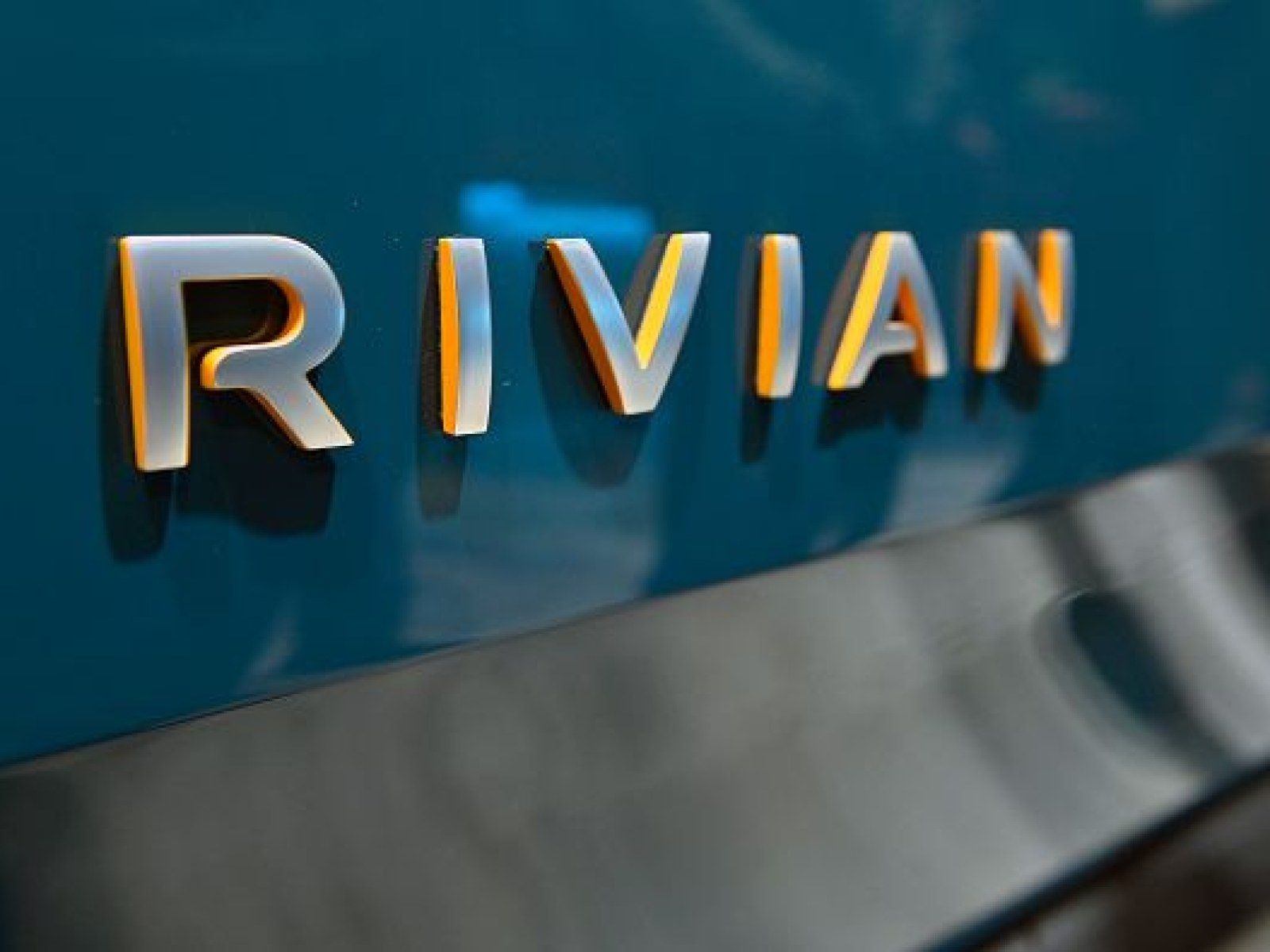Rivian Logo - Price Drop? Rivian Suggests Lower Price Tag On Electric Truck, SUV | IBTimes