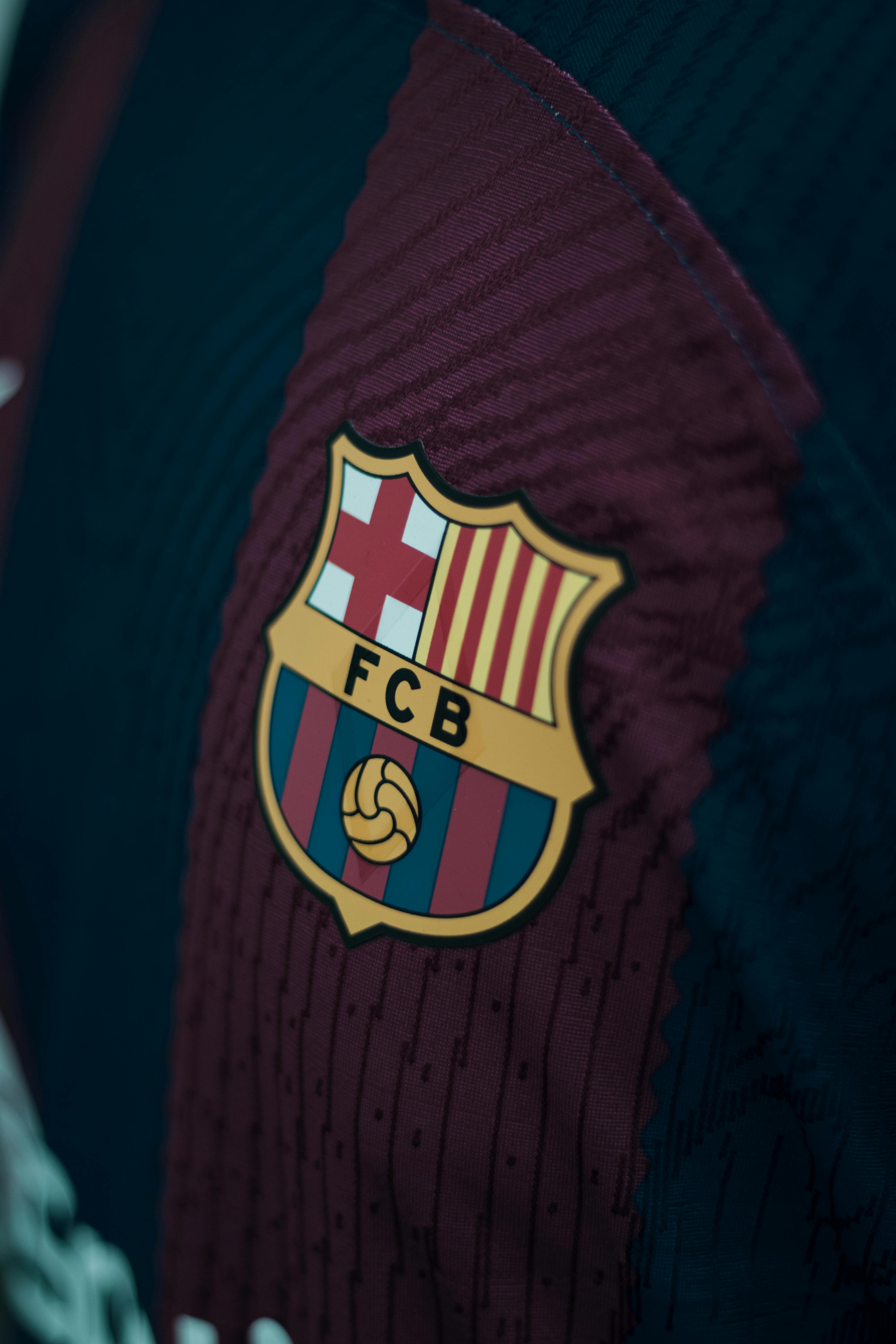 FC Barcelona Logo - Close-up of a Logo of the FC Barcelona Football Club · Free Stock Photo