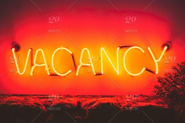 Red and Yellow Word Logo - Neon red and yellow Vacancy sign, words in the wild. stock photo ...