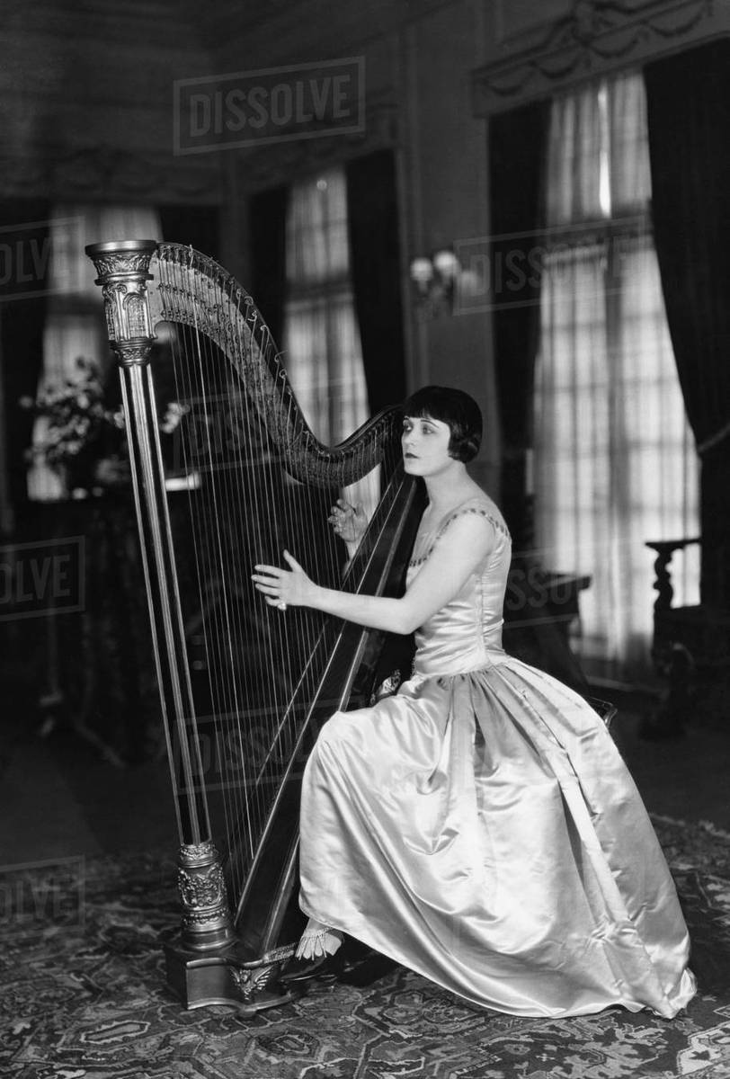 Woman Harp Logo - Woman playing harp - Stock Photo - Dissolve