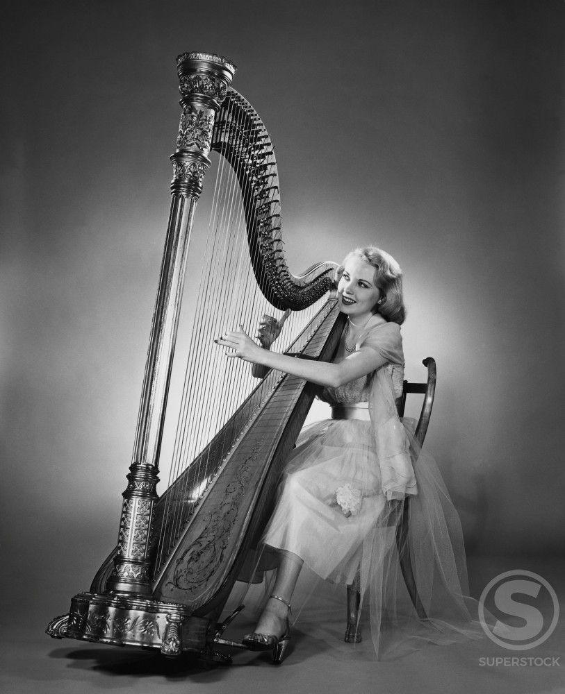 Woman Harp Logo - Young woman playing a harp Stock Photo 255-3364 : Superstock