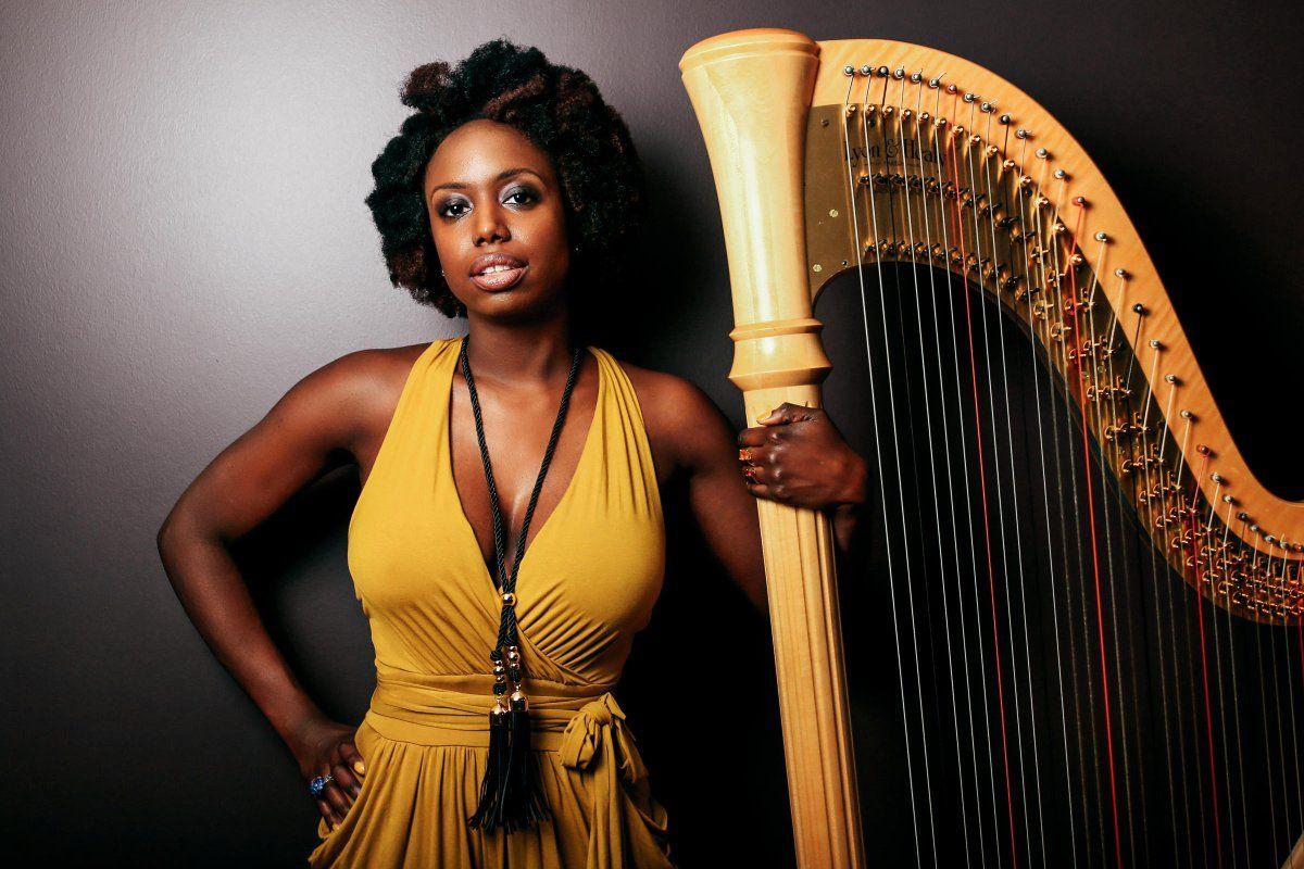 Woman Harp Logo - black woman with harp