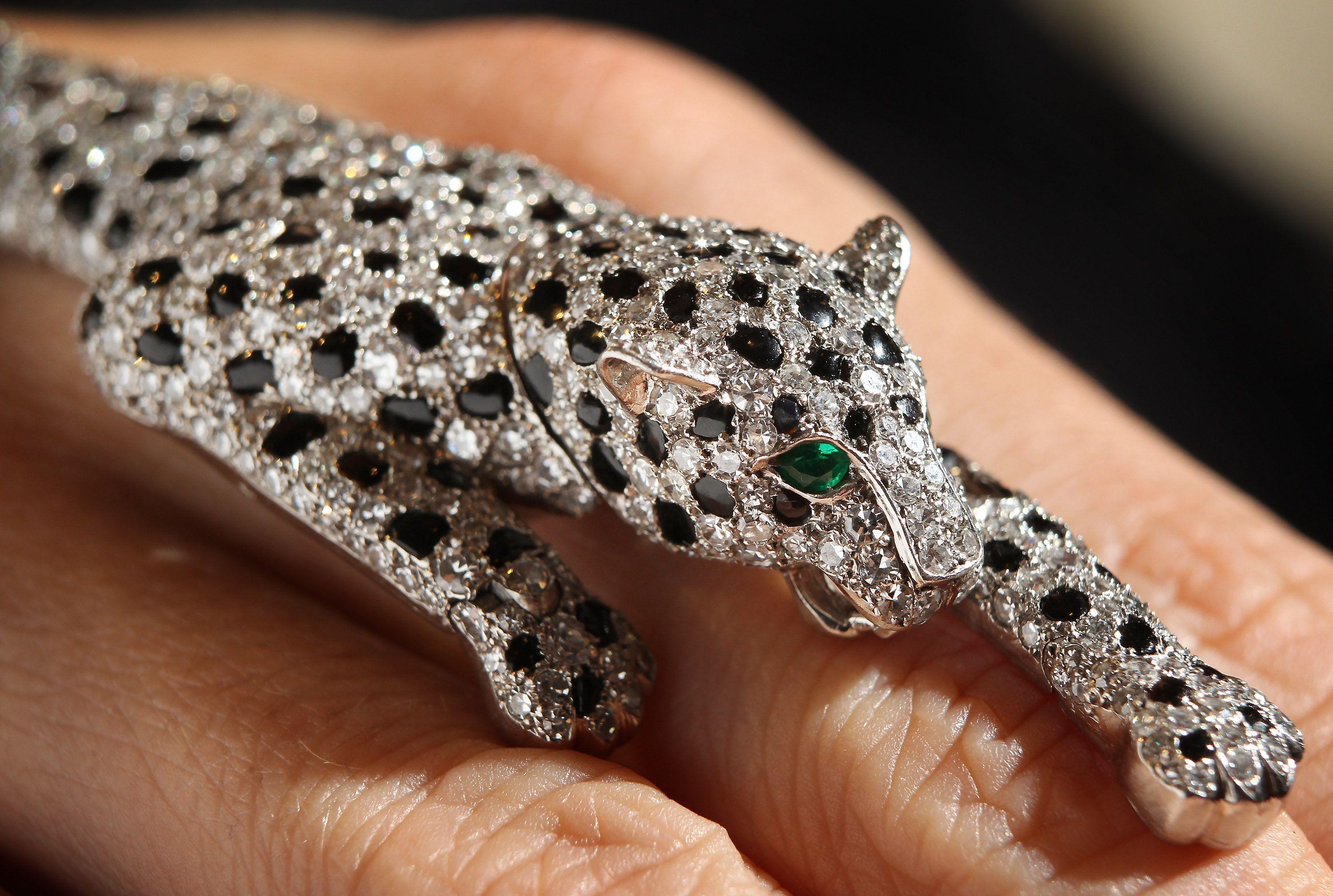 Cartier Panther Logo - The opulent allure of Cartier's bejeweled panther