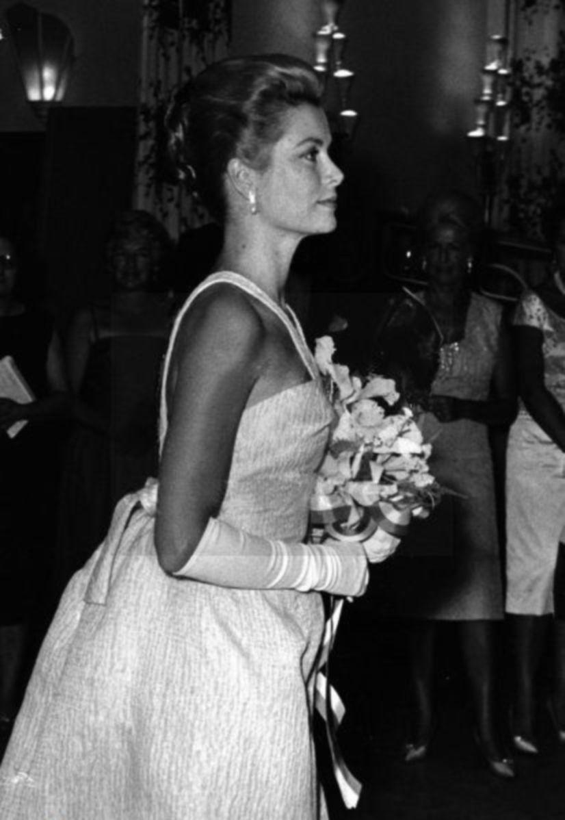 White with Red Cross Ball Logo - Princess Grace arriving at Red Cross Ball Gala. grace kelly