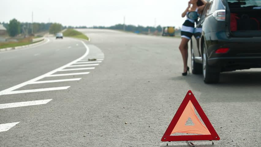 Broken Red Triangle Logo - Red warning triangle with a broken down car