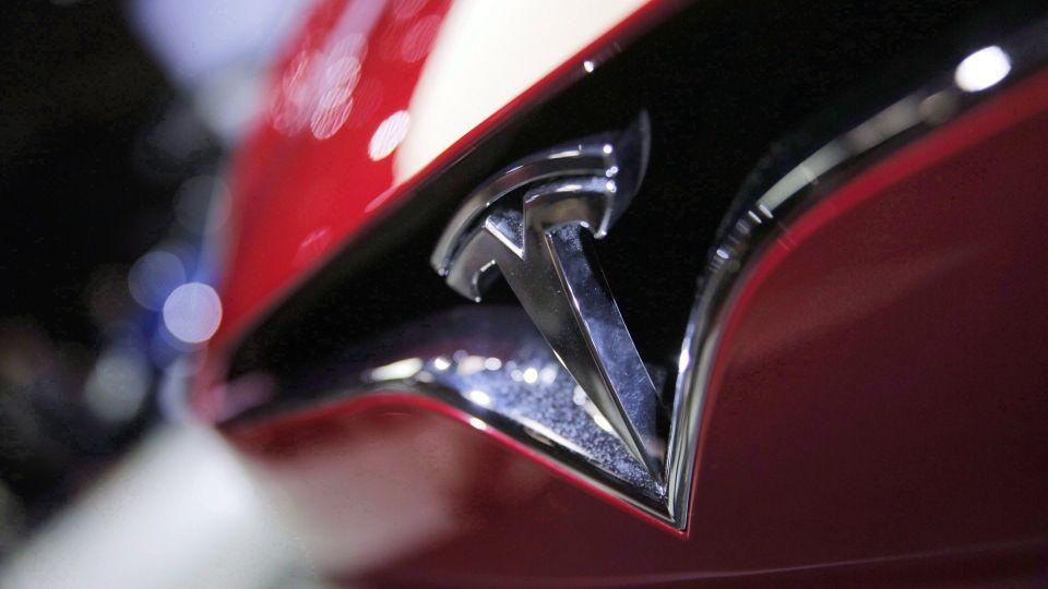 Tesla Auto Logo - Shares of electric car maker Tesla Inc. fall