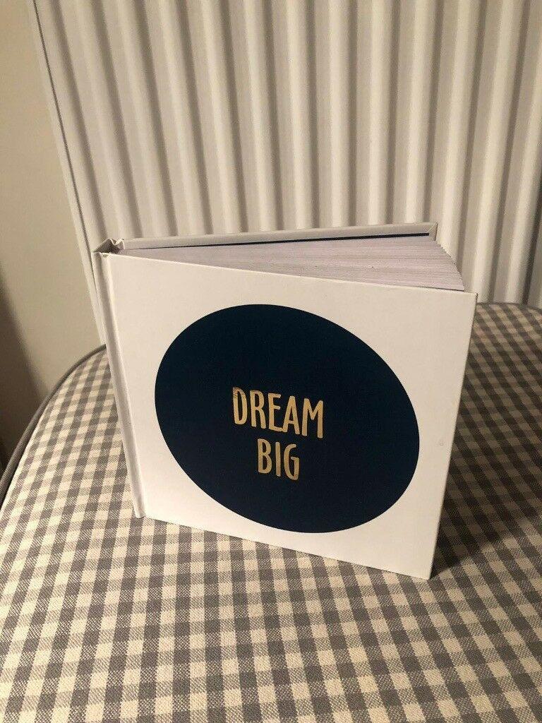 Blue Circle White Z Logo - White notebook with navy blue circle and gold text 'DREAM BIG'