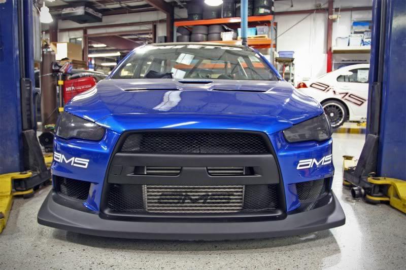 Evo X Logo - want to debadge the front logo, and black the AC line. how