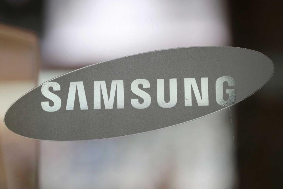 Samsung Corp Logo - The corporate logo of Samsung Electronics Co. is seen at its shop in ...