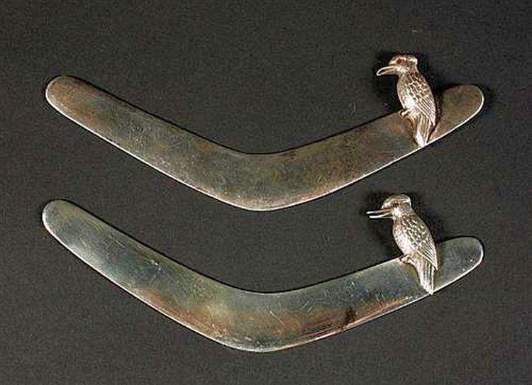 Two Silver Boomerang Logo - Two silver boomerang letter… - Vizard Foundation Collection ...