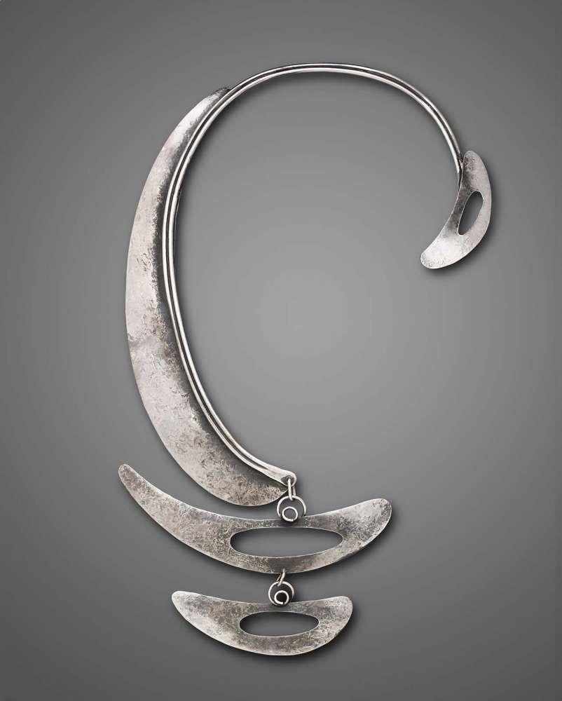 Two Silver Boomerang Logo - C-shaped silver necklace with three boomerang-shaped elements each ...