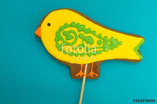 Yellow Bird Blue Background Logo - Gingerbread in the form of a yellow 